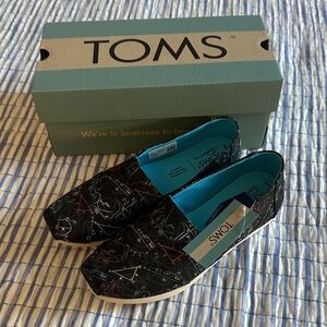 TOMS Glow In the Dark Black Slip-Ons with Vibrant Math Symbol Pattern
